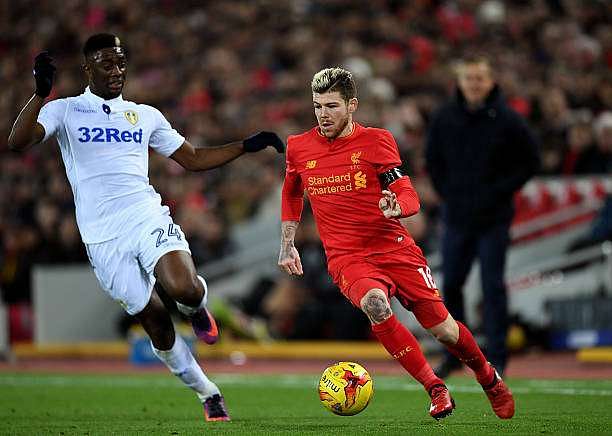 LIVERPOOL, ENGLAND - NOVEMBER 29: Alberto Moreno of Liverpool takes on Hadi Sacko of Leeds United during the EFL Cup Quarter-Final match between Liverpool and Leeds United at Anfield on November 29, 2016 in Liverpool, England. (Photo by Laurence Griffiths/Getty Images)